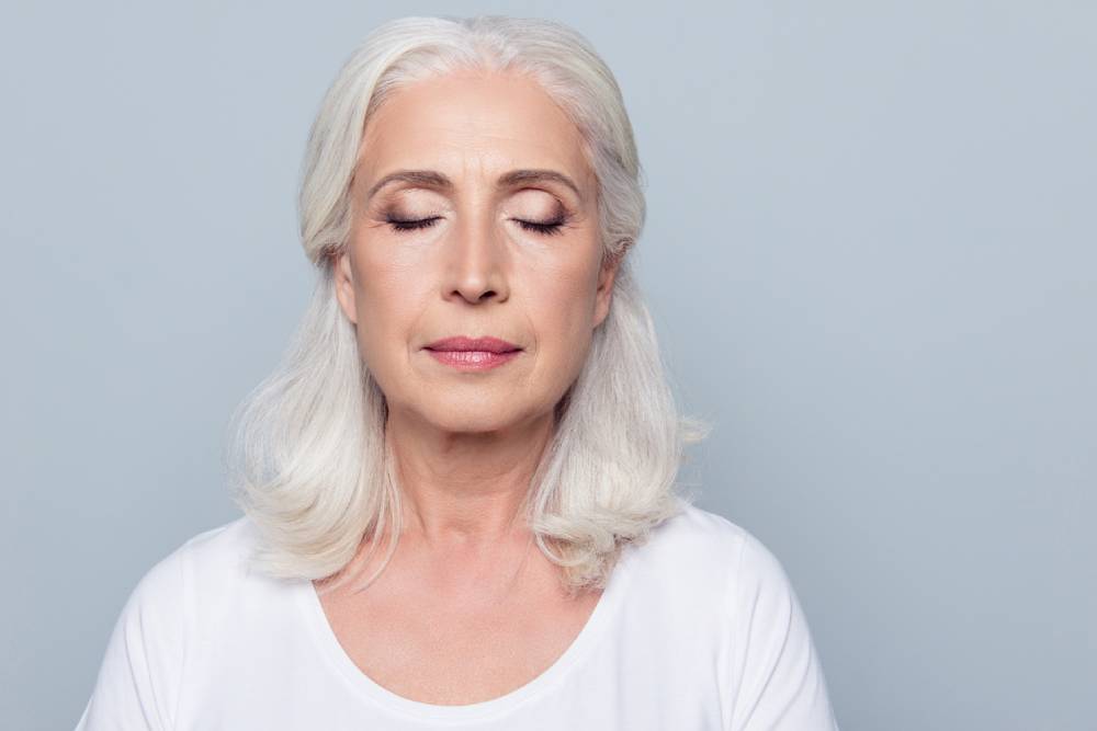 Older woman with closed eyes