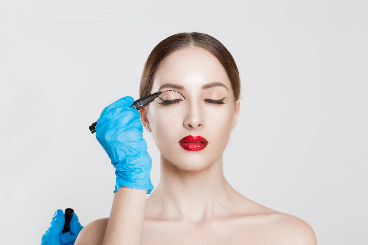 Woman sitting and getting ready before eyelid surgery.