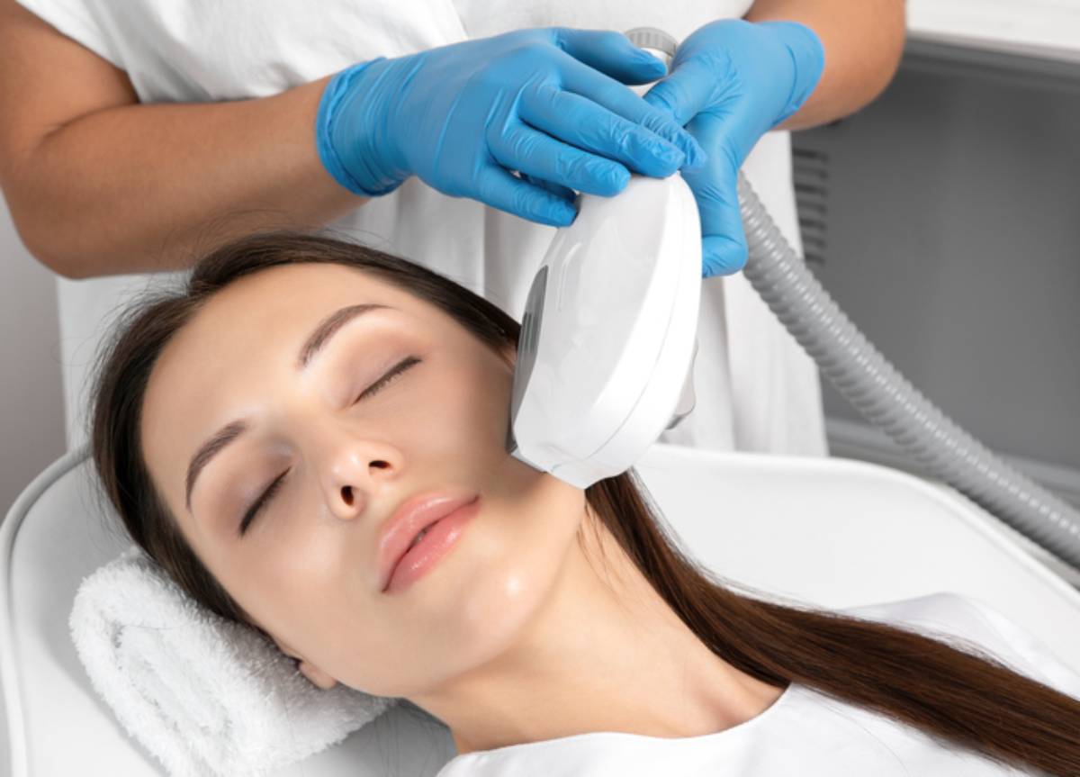 Woman receiving facial procedure.